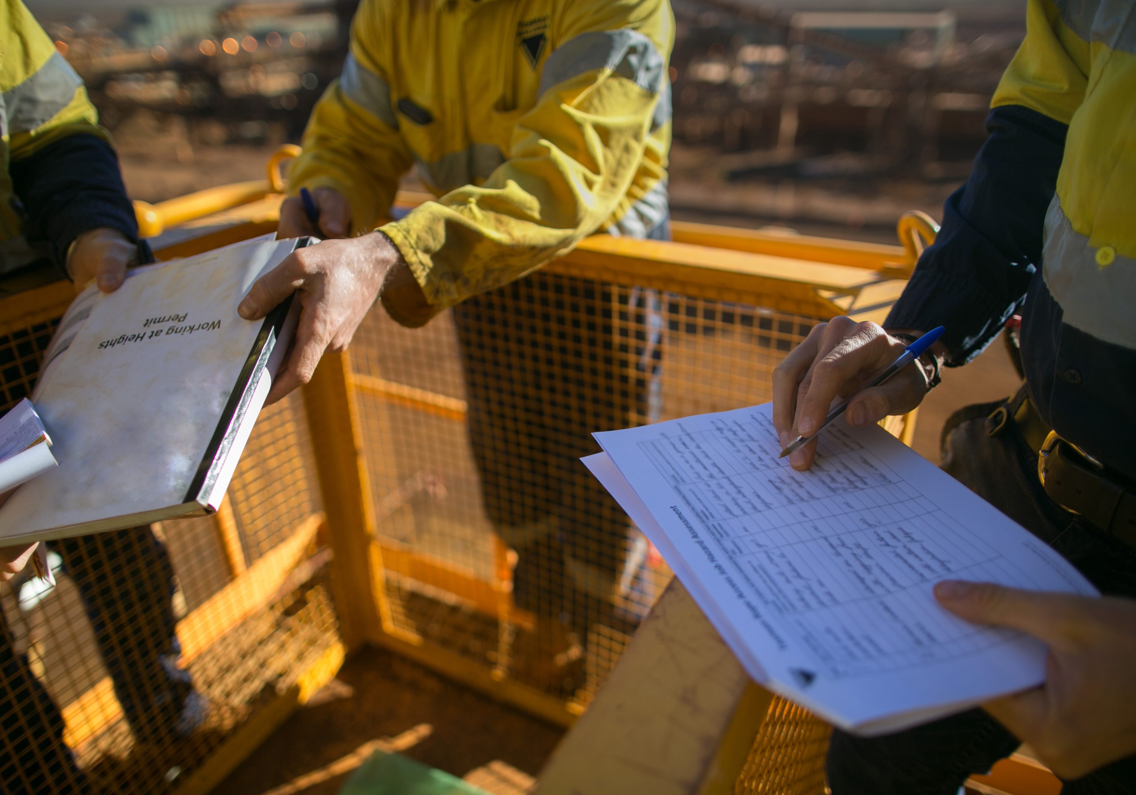 Supervisor checking preventive maintenance work list