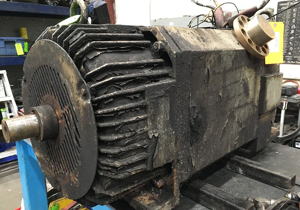 Dirty industrial DC motor in Duke Electric repair shop