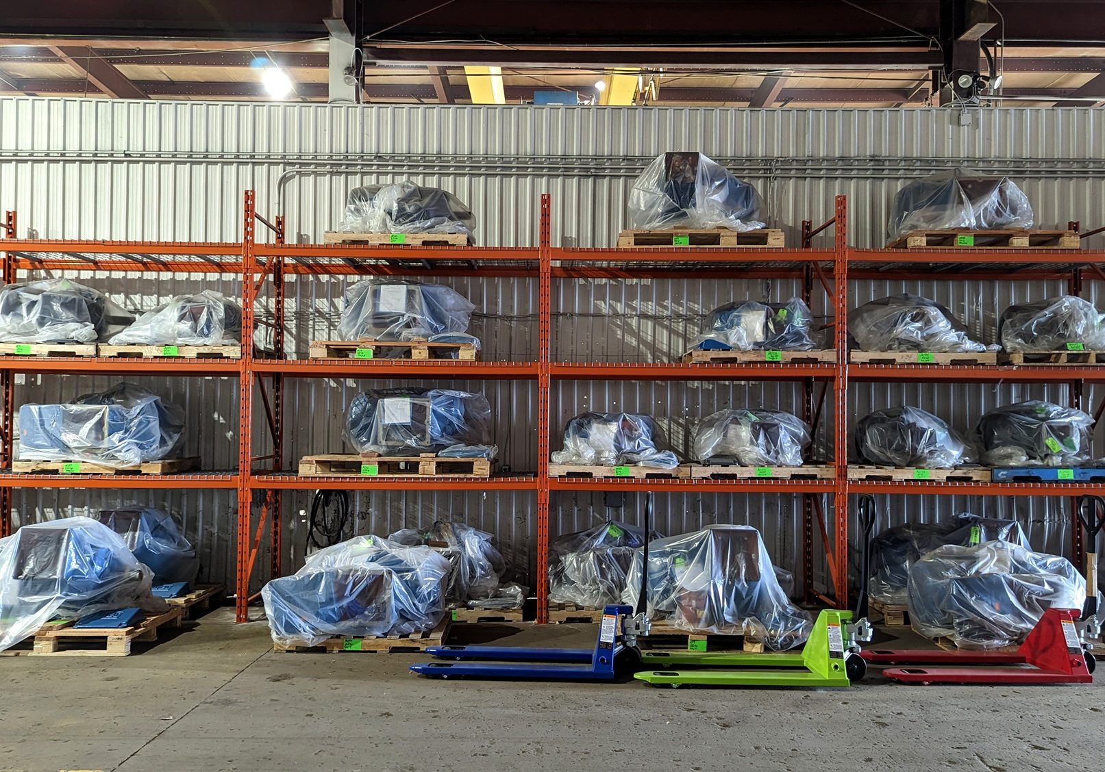 Industrial motors sitting on a heavy duty racks
